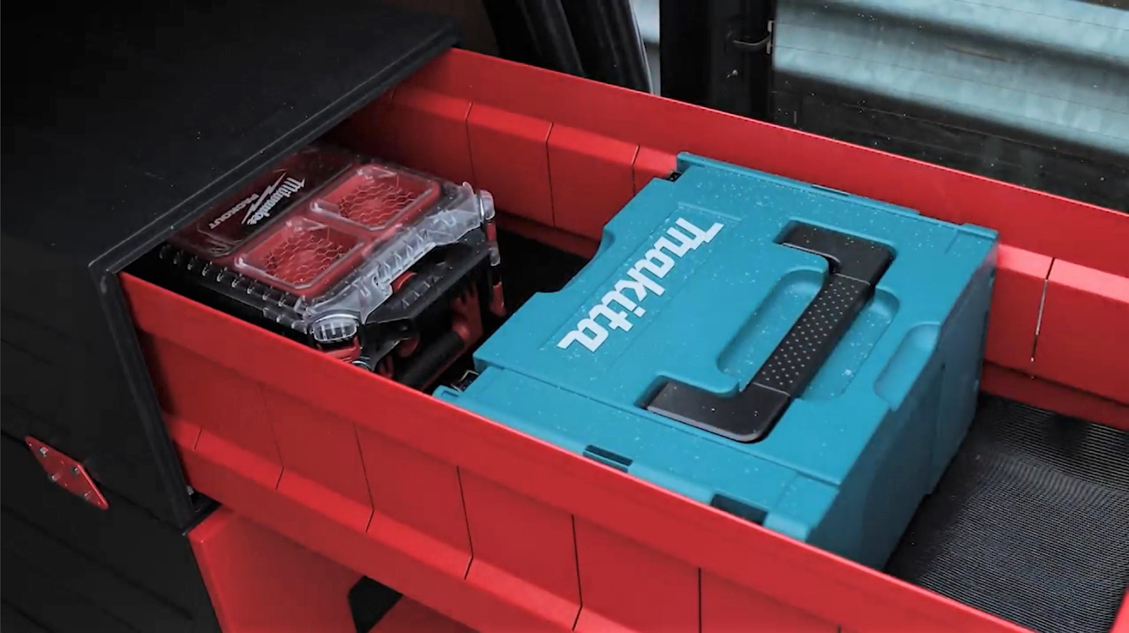 A close up of an open draw from Armorgard TrekDror and in the draw there is two boxes which contain equipment