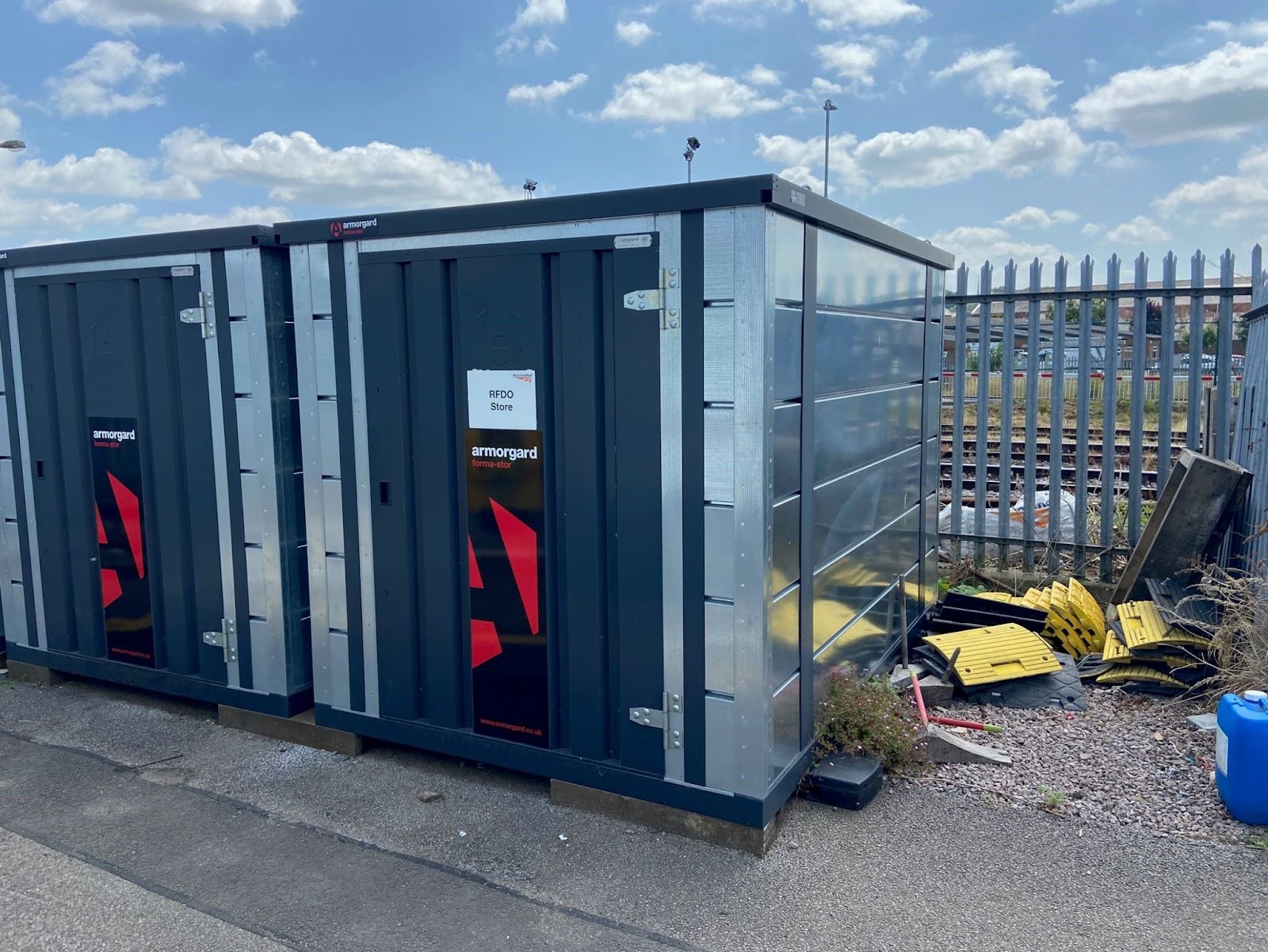 two Armorgard From-Stors next to a railway