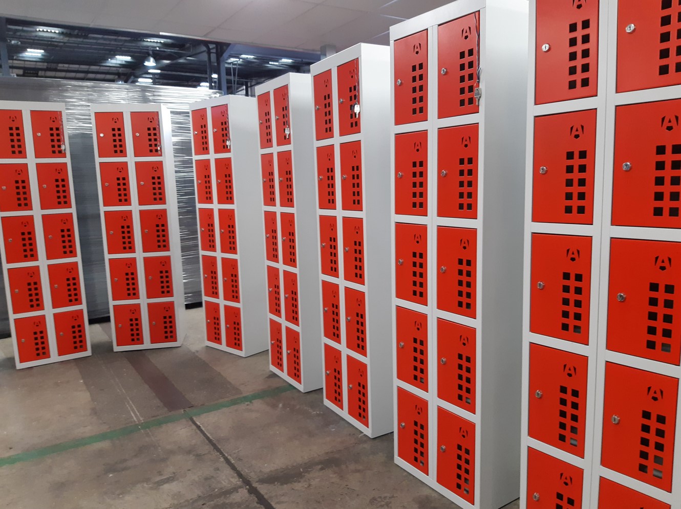7 Armorgard locker powerstation lined up next each other inside a warehouse