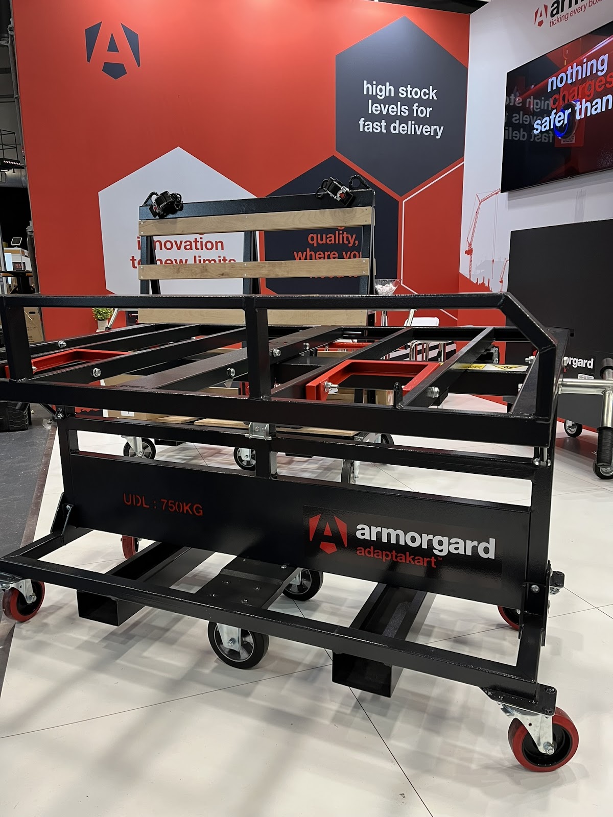 an image of a black cart with red accents called 'adaptakart'