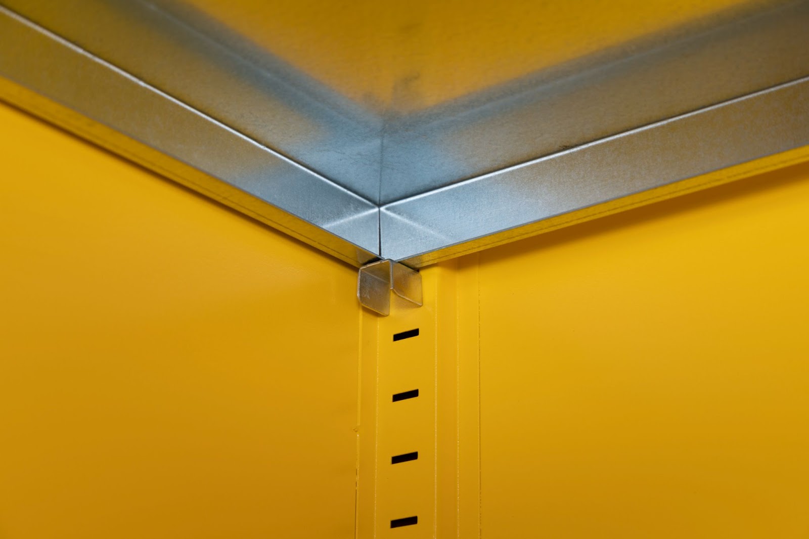 Inside the safestor showing an adjustable shelf fixing, the wall of the safestor has holes going down for a way to insert the adjustable shelf