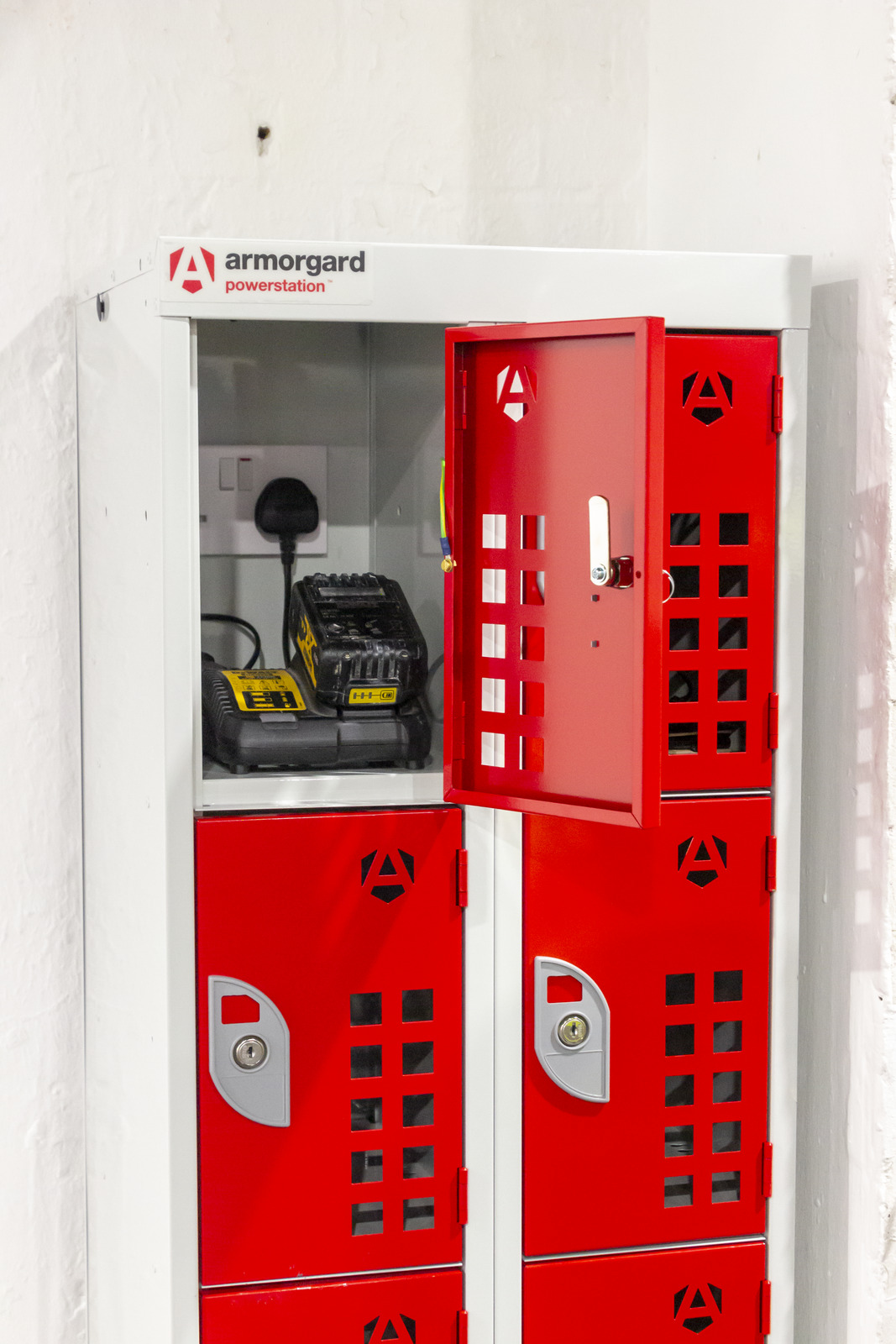 Armorgard powerstation locker with one of the doors open showing a battery charging inside of it
