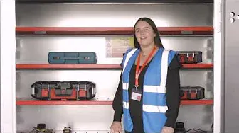 a lady wearing a blue hi vis vest standing the door way of the PowerStor