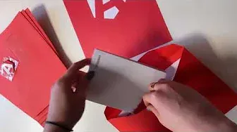 a person putting post in an Armorgard themed envelope