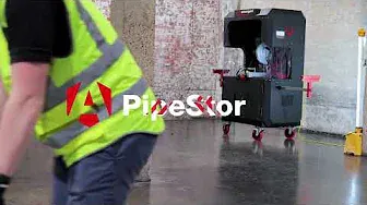 Part of a man in a high vis vest and the PipeStor in the background