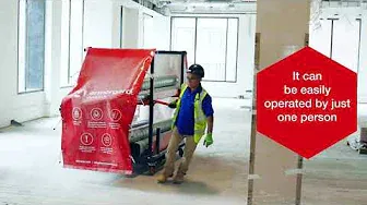 a man in a hi vis vest pulling a Duct Rack at a building site