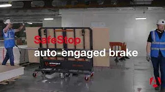 a person in a hi vis vest can be seen pushing an AdaptaKart and the image has text on it saying SafeStop auto-engaged brake